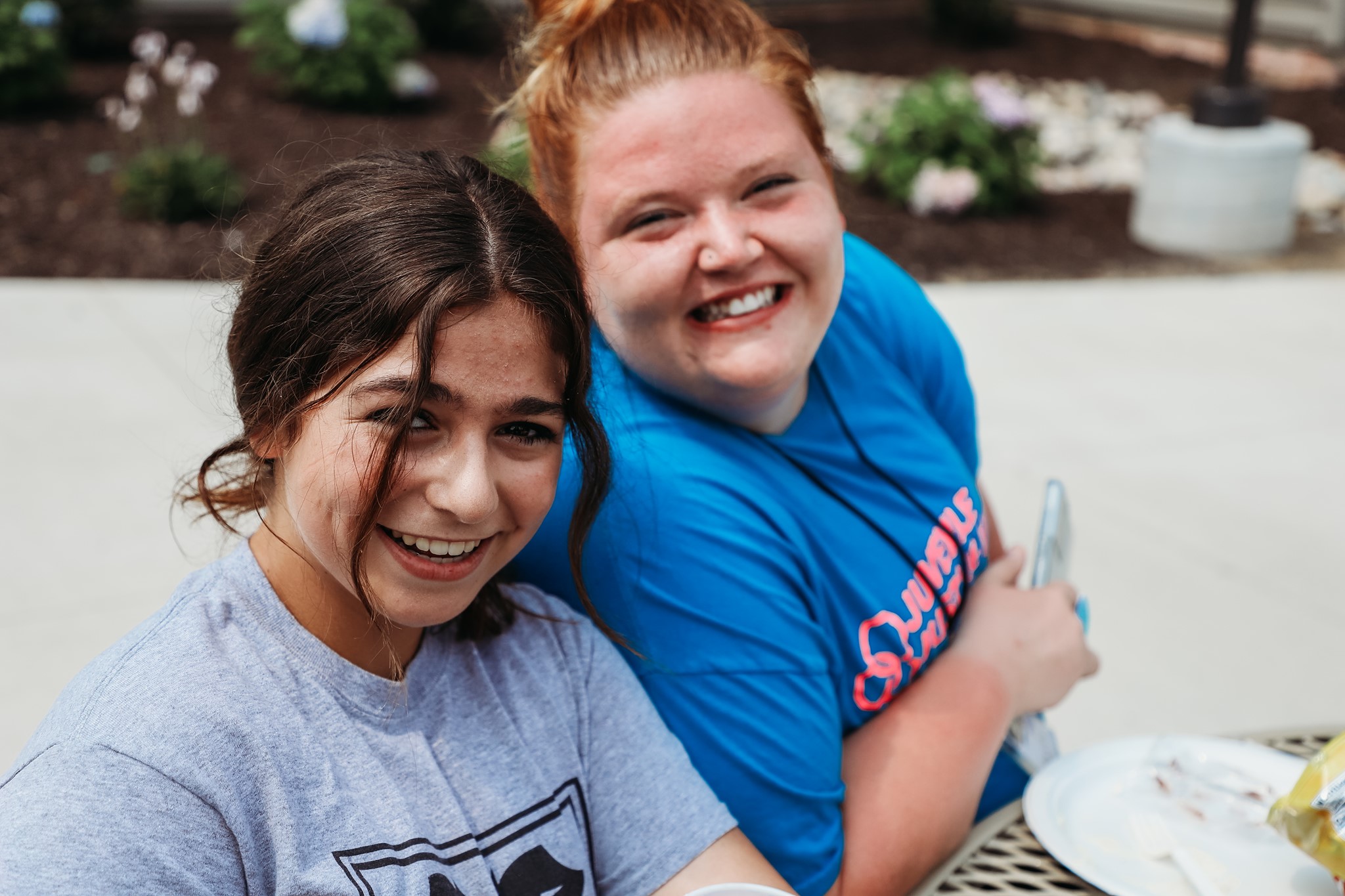 Two girls smile