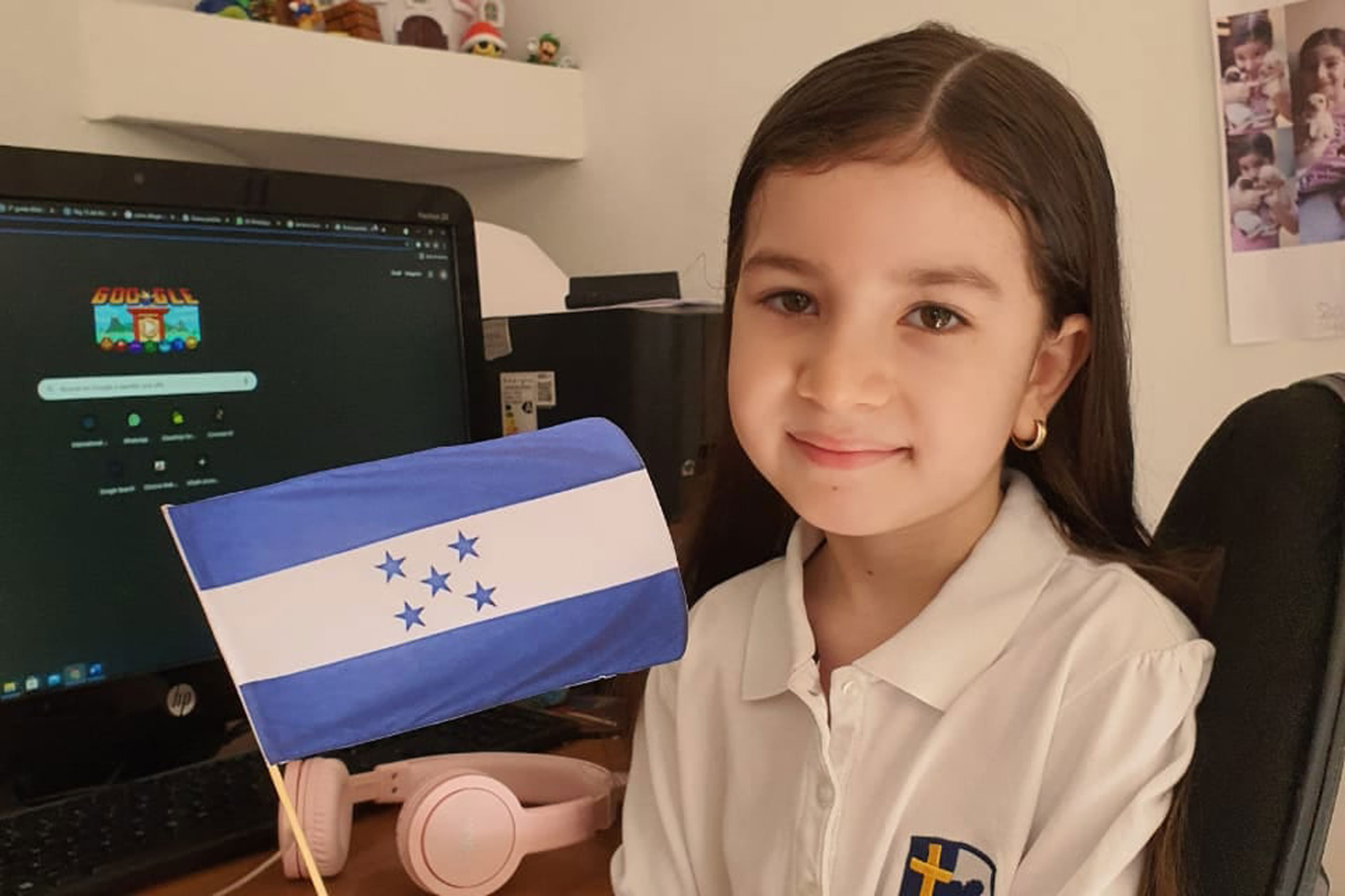 Student holding Honduran flag