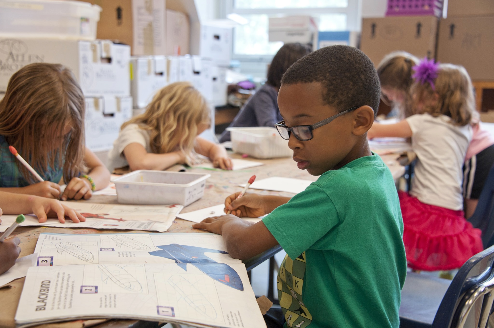 Student works on assignment at desk