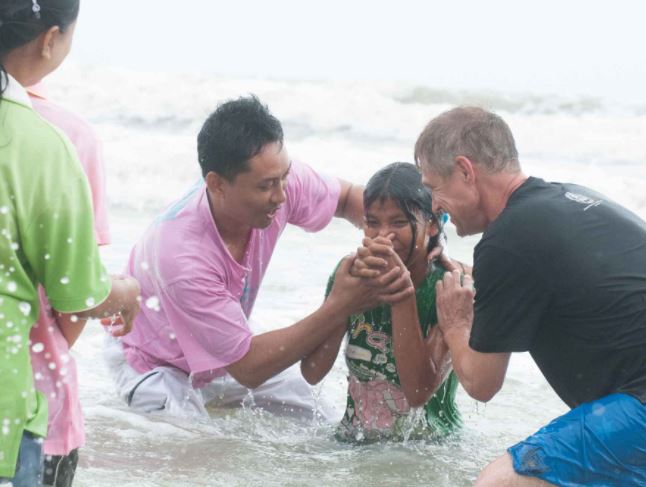 Girl getting baptized