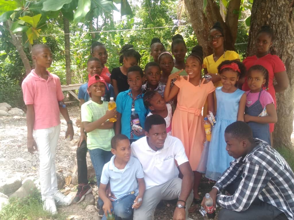 Group of students involved in an IMPACT club in Haiti