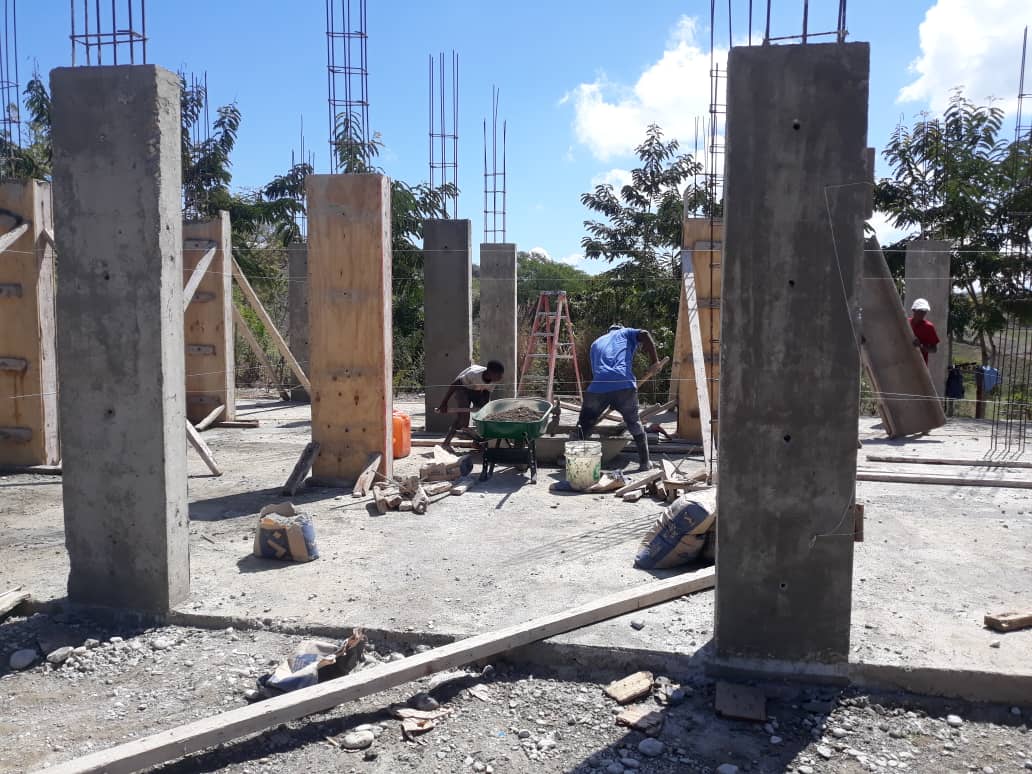 Workers constructing a church building