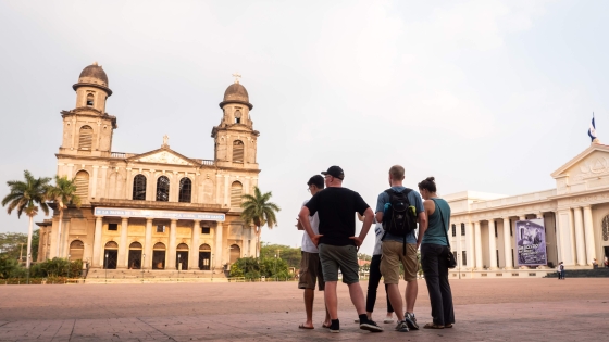 People standing in front of old church