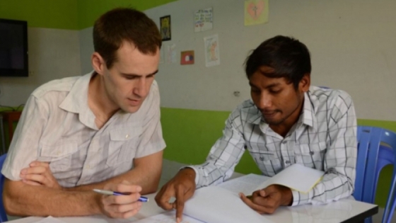 Missionary sitting with friend