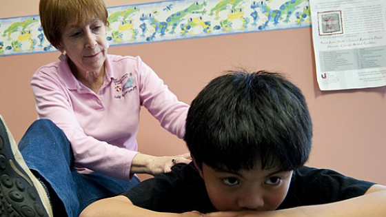 Young boy with physical therapist