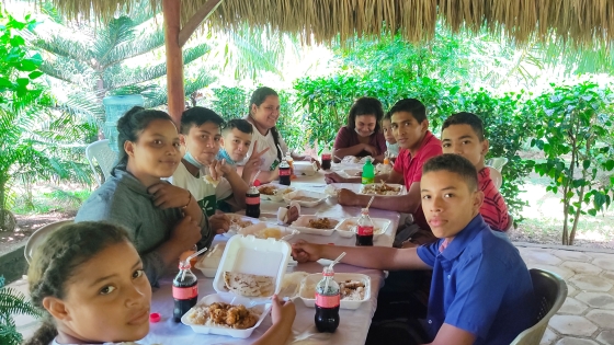 Patricia and other members of IMPACT enjoy dinner together