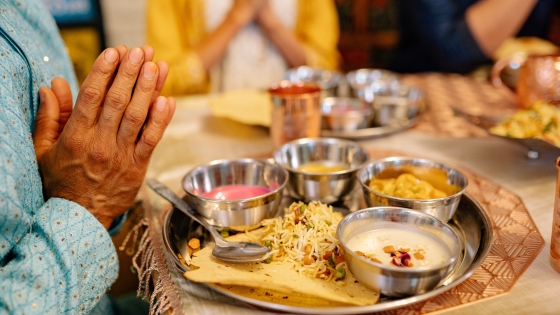 People praying at a meal