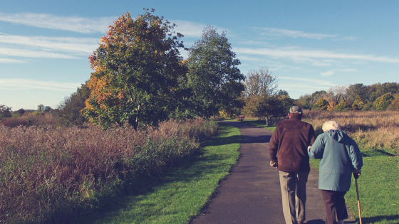 A couple walking down a path