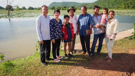 Resonate missionaries Navy and Ly with Pastor Neang, members of his family, and a family by the reservoir where they celebrated baptisms