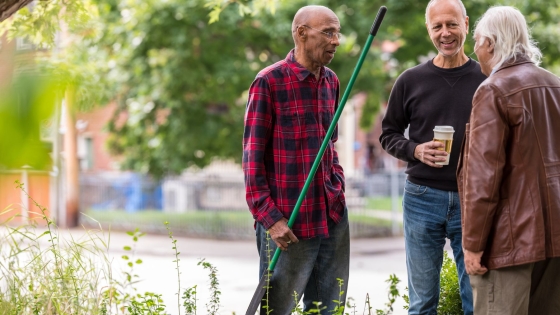 Three men chatting outside