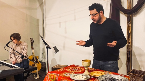 Pastor Moses Pacheco prays before communion