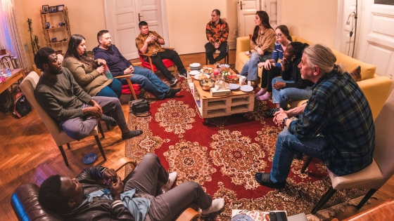 Resonate missionary Jeff Bouman and students gather in a living room