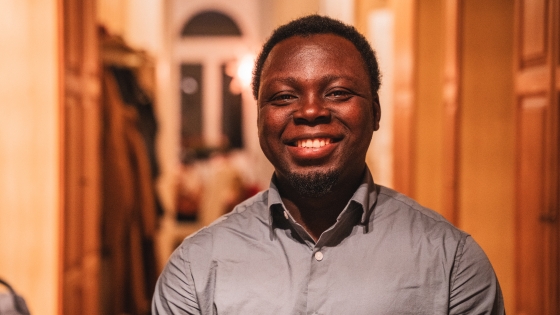 A headshot of Hanis smiling 