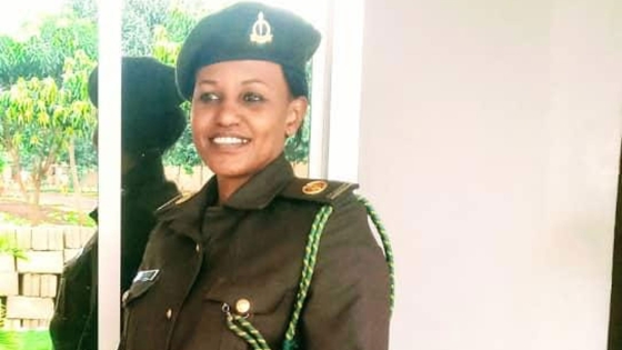Evah stands, smiling, in her uniform