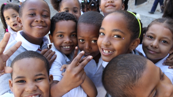 A close up of a group of students as they smile
