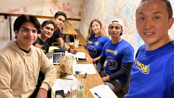Resonate missionary James Lee with David, Victoria, and Abraham studying the Bible at a local coffee shop