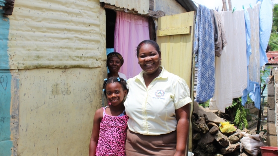 Alejandra visiting a student at her home