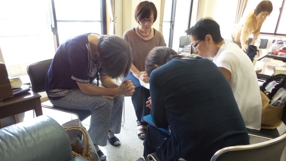 Mrs. Ohashi (center, brown shirt) knows the value in having fellowship with fellow believers.