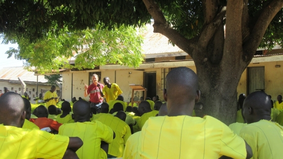 Josh standing in front of the group of prisoners