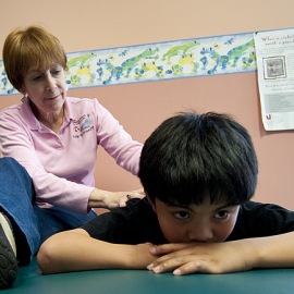 Young boy with physical therapist