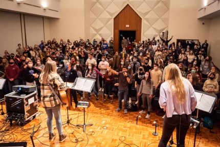 Students worshipping at Campus Ministry at Grand Valley State University, a Resonate partner in Michigan