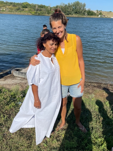 Janelle and Lucretia standing by a lake before Lucretia's baptism