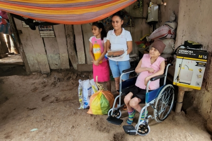 Maria with her new wheelchair