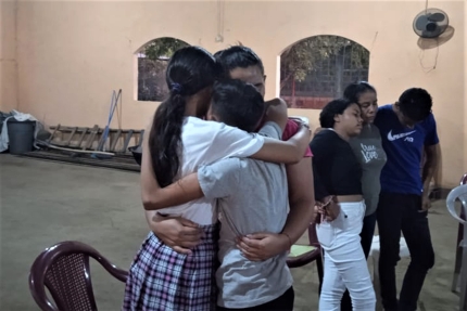 A group of people hugging