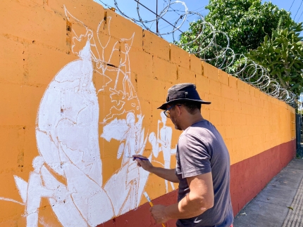Painting a mural on a wall