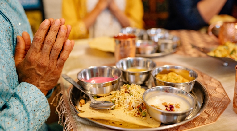 Praying at a meal People praying at a meal