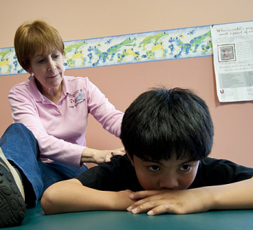 Young boy with physical therapist