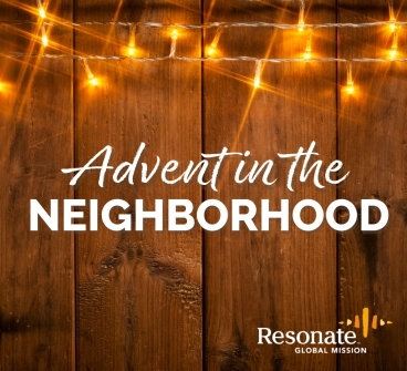 "Advent in the Neighborhood" text over a close-up photo of a wooden fence with Christmas lights hanging up