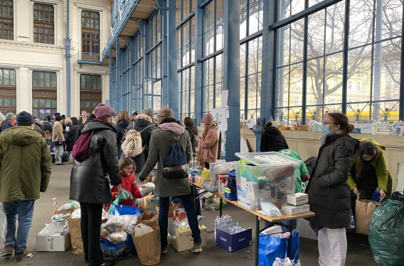 The Reformed Church of Hungary's Church Aid volunteers handing out welcome bags of essentials at the Nyugati train station in Budapest