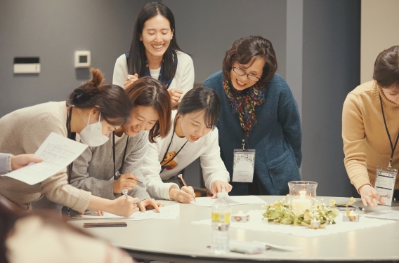 Resonate missionary MiSook Gho and a group of pastors' wives at a retreat