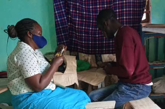 Harriet's Discipleship Group Harriet teaching a young person in her community a craft