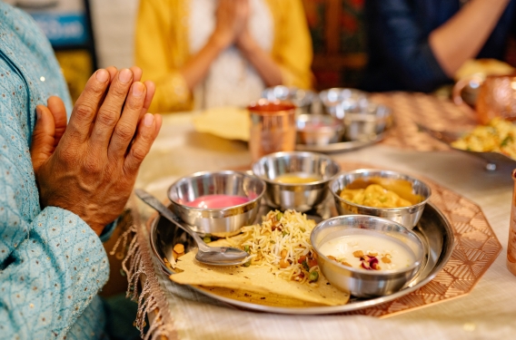 Praying at a meal People praying at a meal