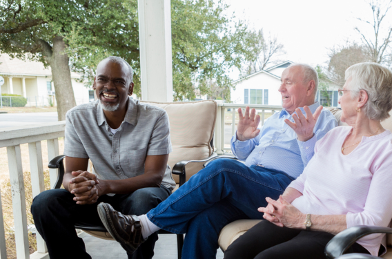 Neighbor Porch Chats Three people talking and laughing on a porch