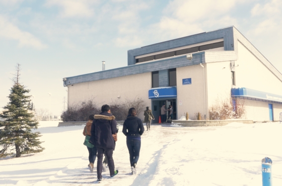 People walking into a church building