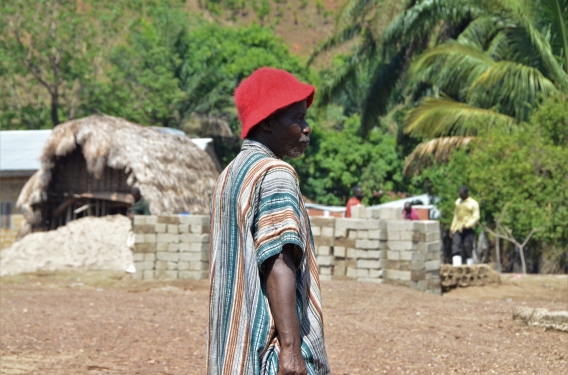 A man stands in a village