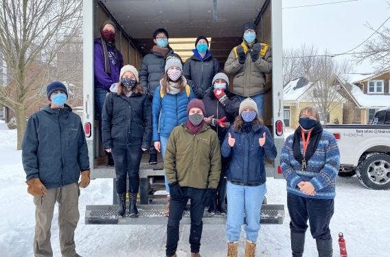Love Western Students unload food from a truck