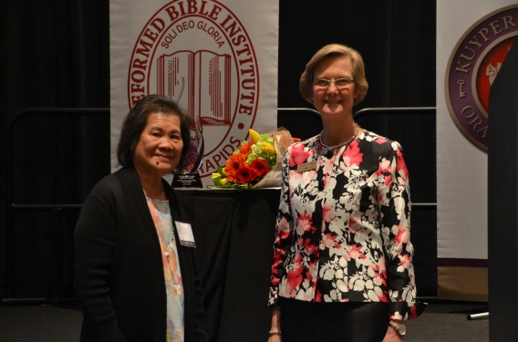 Lucy with Kuyper College's president, Dr. Patricia Harris