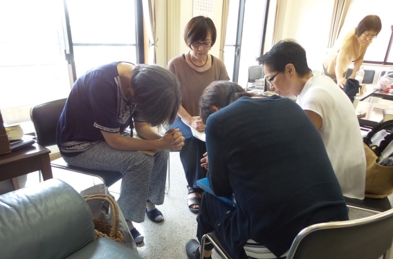 Mrs. Ohashi (center, brown shirt) knows the value in having fellowship with fellow believers.