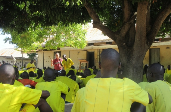 Josh standing in front of the group of prisoners